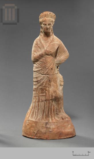 Terracotta figurine of a standing female figure