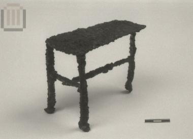 Iron model of a three-legged table