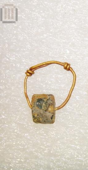 Gold hoop earring with suspended glass bead