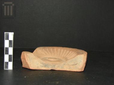 Part of a clay lamp mould