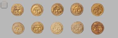 Twenty three gilded terracotta buttons with a gorgoneion