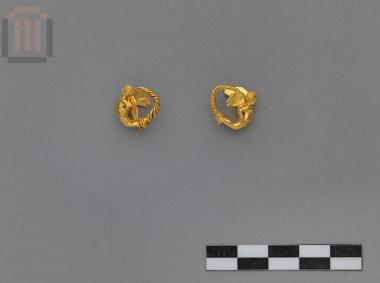 A pair of gold earrings