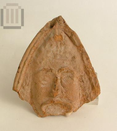 Part of a Lakonian antefix with a tragic mask