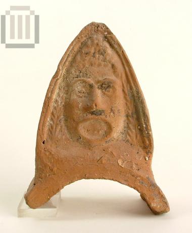 Part of a Lakonian antefix with a tragic mask