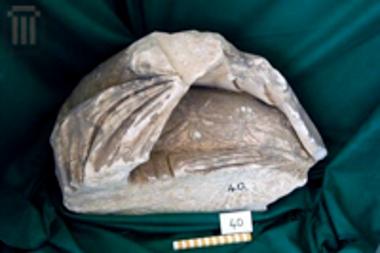 Part of the himation fold of a female figure from a funerary naiskos