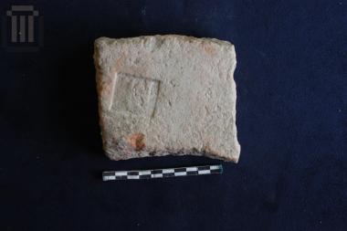 Part of a brick with a square sealing