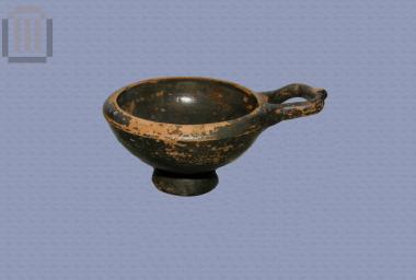 Black-glazed kyathion with handle from the territory of Ambracia