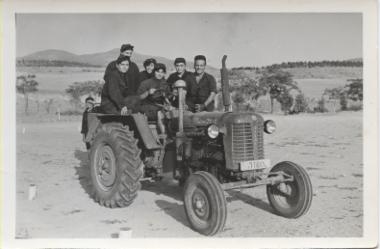 Students learning to drive a tractor