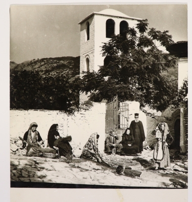 Snapshot of daily life outside the Holy Church of St. Dimitriou Theologu Thassos, 1961