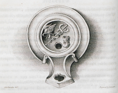 Λυχνάρι με ανάγλυφα τα σύμβολα του Ερμή, από την περιοχή της Καβάλας.