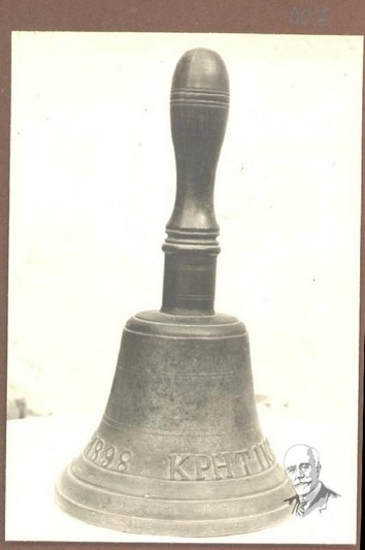 Photograph showing a court hand-bell bearing the inscription 